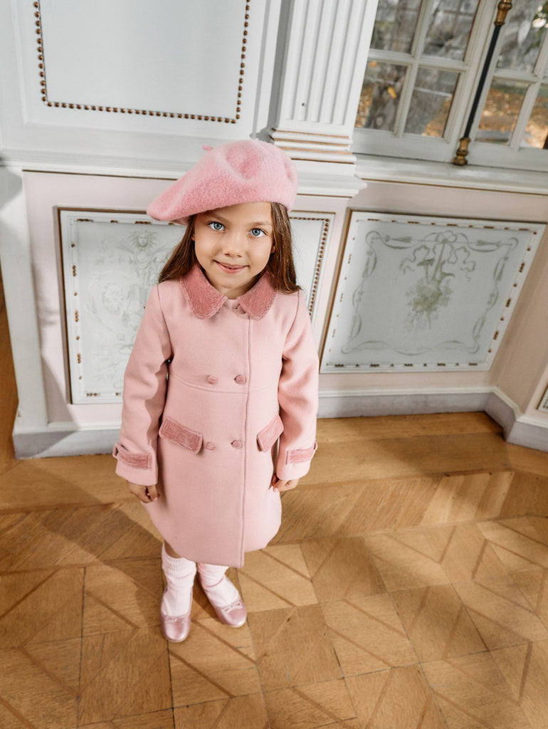 Elegant pale pink coat with refined details