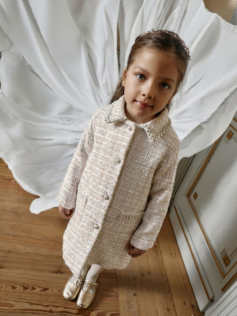 Elegant golden coat with pearl buttons